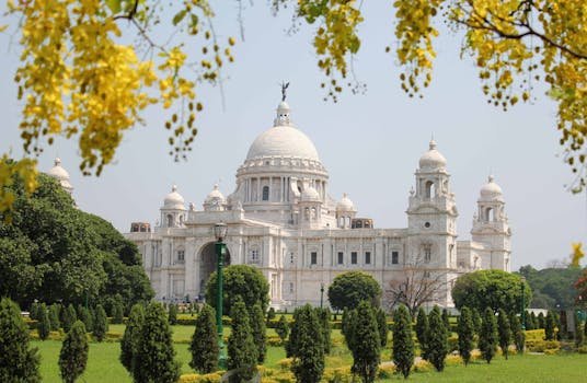 Beautiful view of Victoria Memorial surrounded by gardens in Kolkata, India.