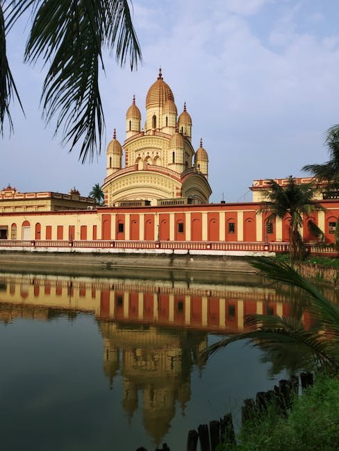 Stunning reflection of the Dakshineswar Kali Temple on the water in Kolkata, West Bengal, India.